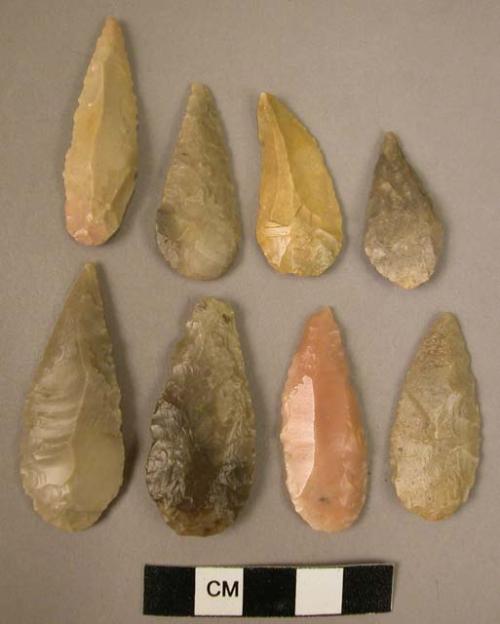 8 flint drop-shaped points with bevelled & rounded bases made on small flakes