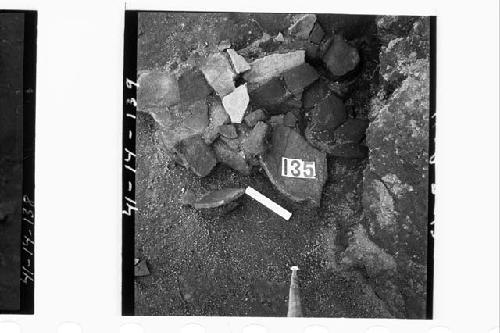 Broken pottery against vert. wall of Ph. I terrace in sect. N60.6E. Md. 2-S.