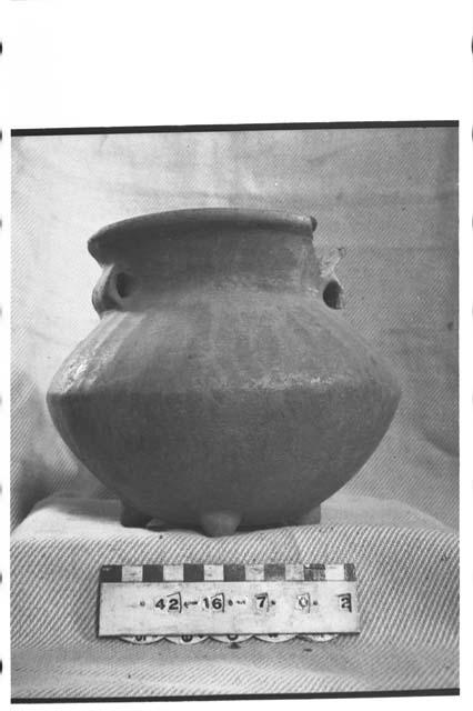 Tetrapodal lost-color pottery jar
