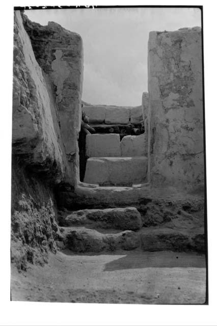 A-V: looking thru doorway in E. wall of Room 19. Lower steps were used in Period