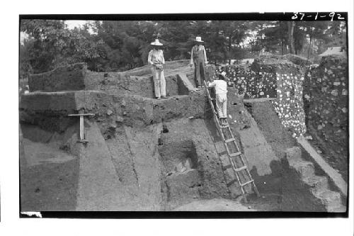 Men standing on top of pyramid 5; Mound A