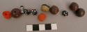 Beads, coral, stone, blue glass with white, fragments, plant fiber