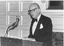 William Howells at podium at Dinner in honor of Gordon Willey, April 26, 1983