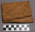 Man's basketry tobacco pouch. Made by women.