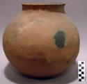 Ceramic jar, orange with black firecloud exterior, flared rim