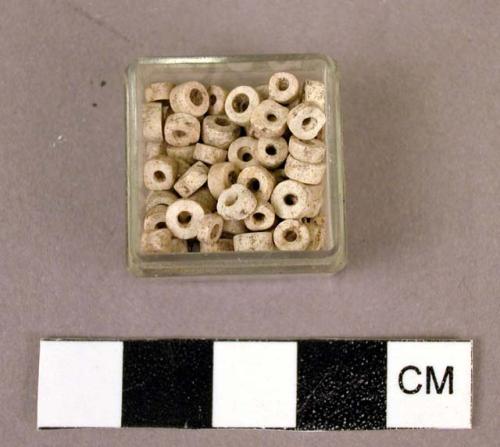 Box of white beads (2 red, 1 black not associated)