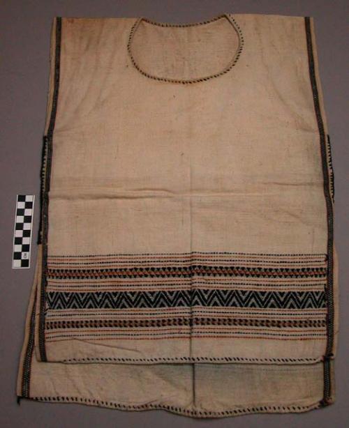 Man's cotton vest. Sleeveless, slip-on; white with decorated borders in brocade