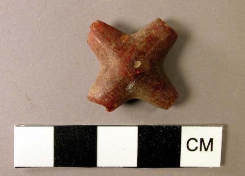 Cross-shaped amber pendant perforated through both arms