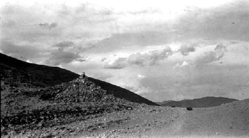 Rock mound at roadside in hills