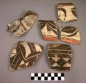 Ceramic jar sherds, black on white, geometric design, some with red