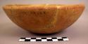Potsherds and 5 red bowls; large red jar, fragmentary; bowl, incised decoration,