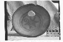 Fragmentary tripodal dichrome pottery bowl.