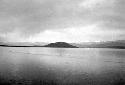 Scene of lake with distant mountains