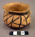 Ceramic jar, small, black on cream, geometric design, flared rim, handle broken