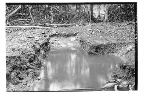 Looking E. at excavation in Little Resevoir W. of causeway connecting A and B Gr