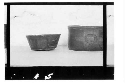 a. Flairing bowl: brown, red, black colors separated by incising.  b. Red and bl