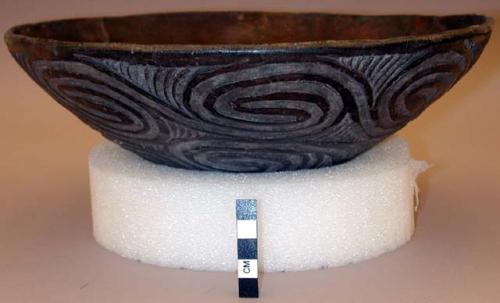 Bowl with carved and painted design