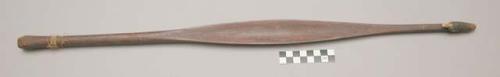 Concave wooden spearthrower, gummed at one end 2'3" x 1 1/2" at widest part