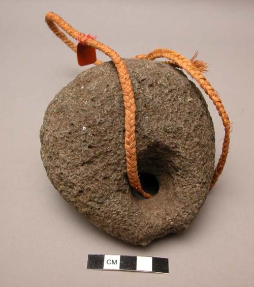 Stone pendant, used for pounding of branches of coral in which a +