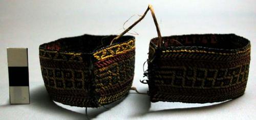 Pair of woven fibre armbands; red, yellow, and black ("shemshin")