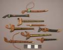 Swords in scabbards, miniature, wood or metal sheaths, horn? blades