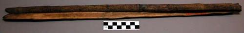 Wooden tongs ("terap yembit") used to turn over food baking in the fire. Incised