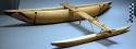 Model outrigger canoe; natural wood with painted design