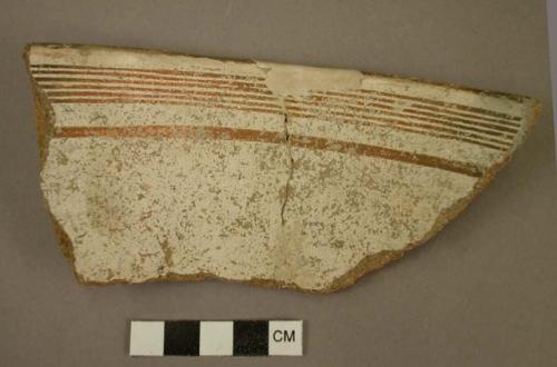 Ceramic rim sherd, red bands on white, mended, reconstructed