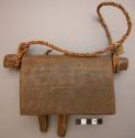 Bell, carved wood, rectangular, two wood clappers, one missing, twisted fiber ti