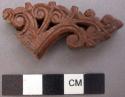 Ornament, carved wood fragment, scroll design, stained on one side