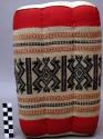 Pillow with woven decorative cover