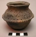 Small pottery bowl (anglit) of incised and fire blackened red ware