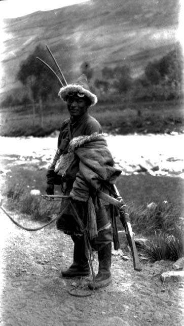 Tibetan man with rifle