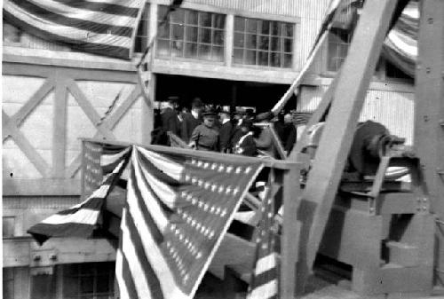 Flag draped gangway leading to ship