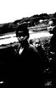 Japanese children with water or fields behind them