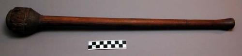 War club with pipe in head