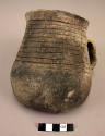 Coiled indian pot with sherds