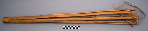 Long primitive fish trap of split bamboo