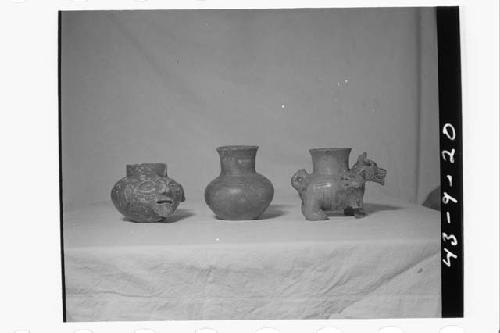 Three plumbate vessels, left- Old man effigy jar (see 43-9-21)
