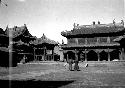 Monks walking in temple courtyard