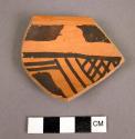 Sherd, black on orange