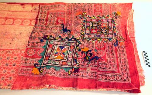 Cloth; cotton with embroidery.