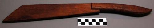 Ceremonial wooden "knife," used in dance which is part of the curative ceremony