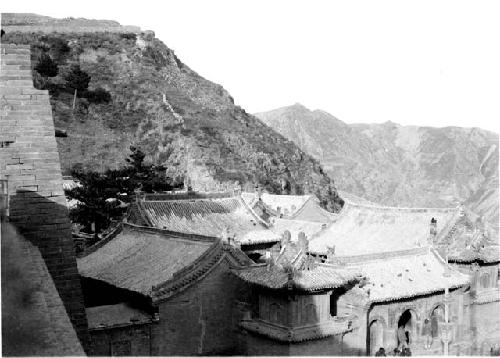 Temple below Great Wall, mountains