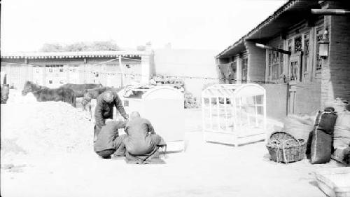 People working on camel carrier