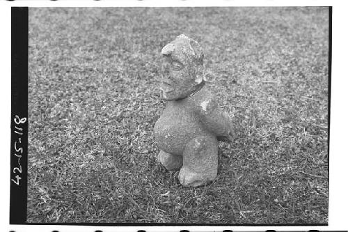 Stone figure of pot-bellied man. Perhaps not genuine