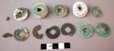 Coins, bronze, circular, square perforation in center, inscribed, corroded