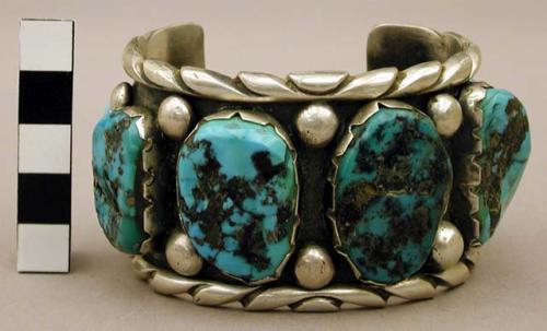 Cuff bracelet, silver band w/ rolled, notched edge, 6 lq. turq. nuggets