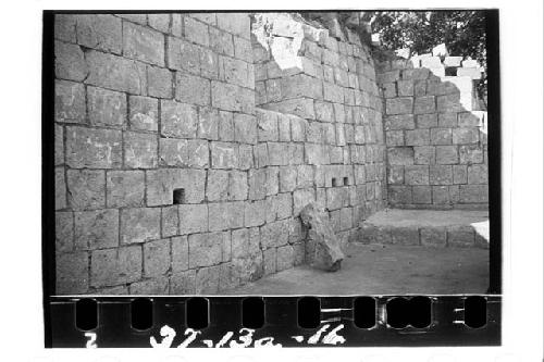 West wall of west room, showing niche, "cord holders" and dais.