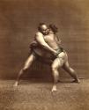 Two sumo wrestlers engaged in a match